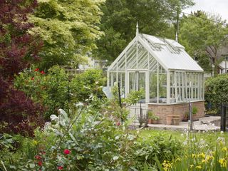 Pretty greenhouse in a garden