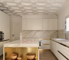 A kitchen with a coffered ceiling