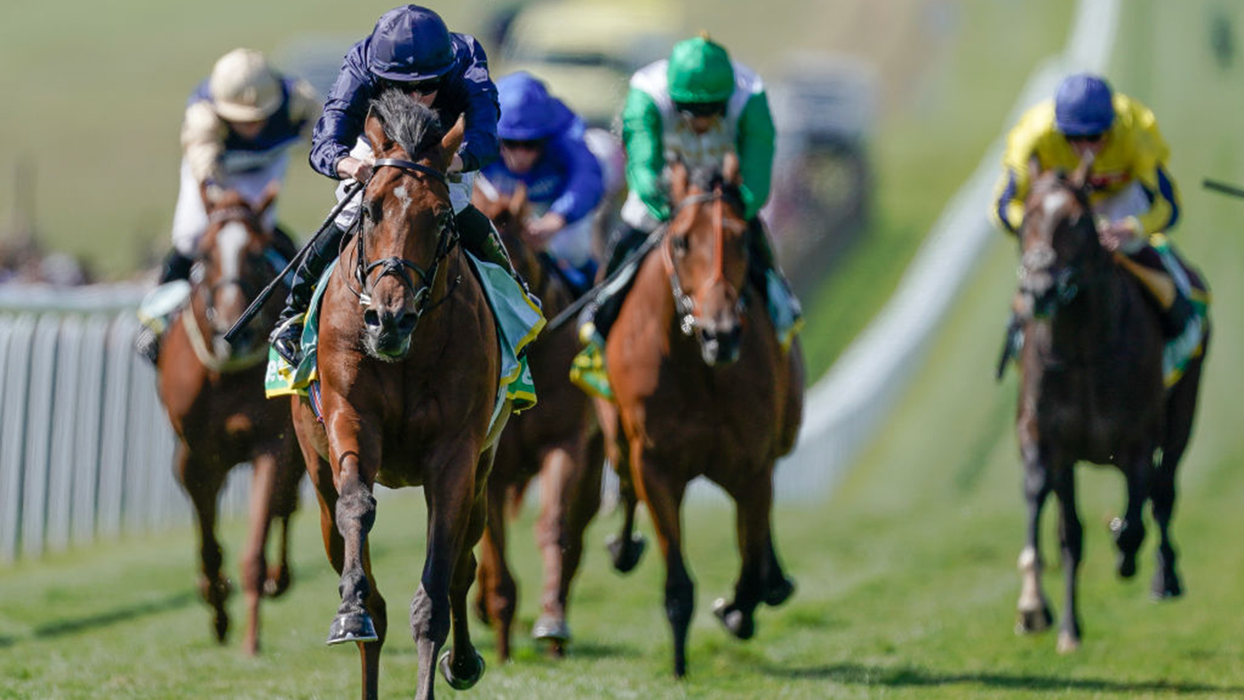 Ryan Moore riding City Of Troy (dark blue) wins The bet365 Superlative Stakes at Newmarket Racecourse.