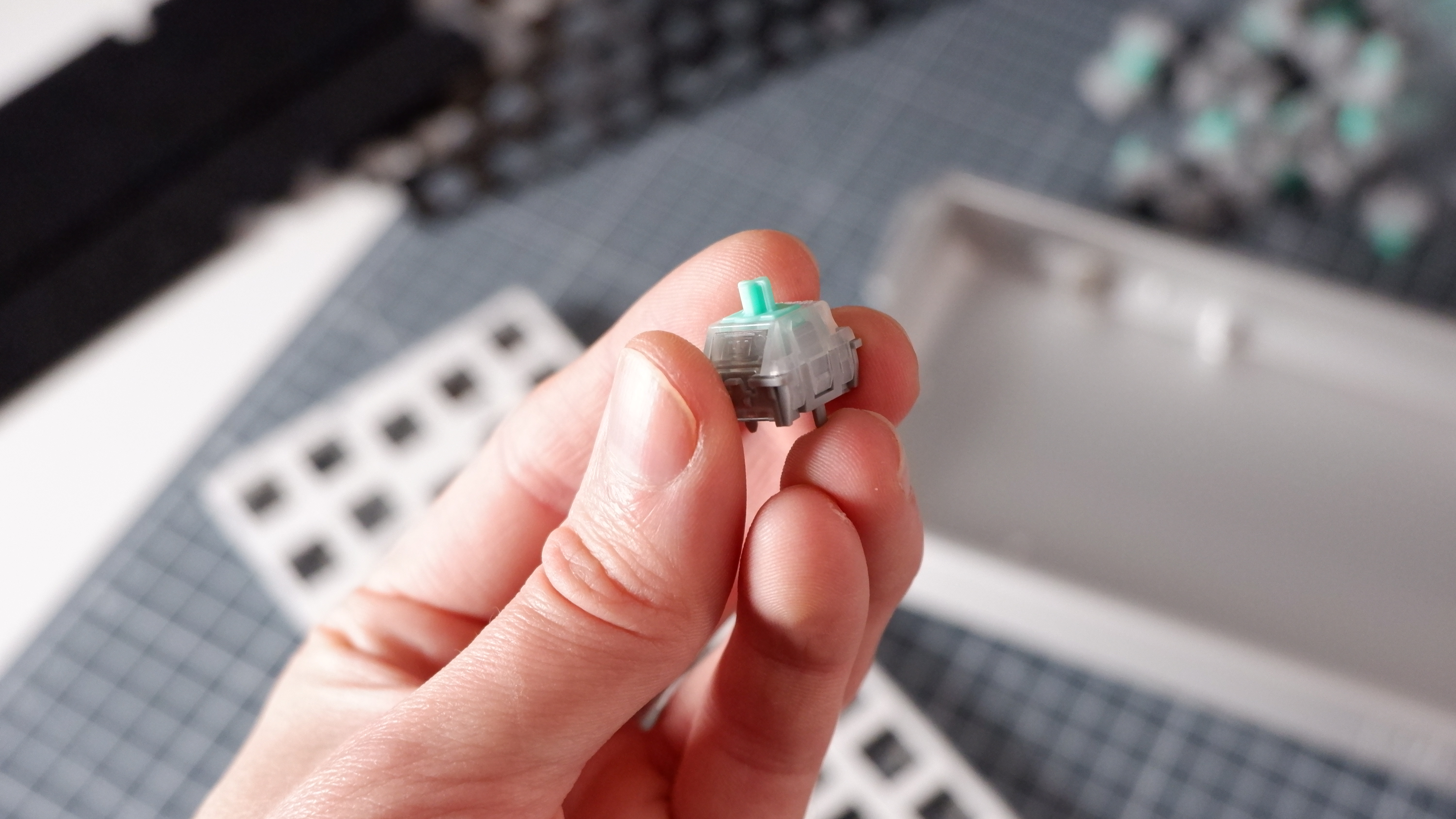 The Wooting 60HE v2 at various stages of being built.