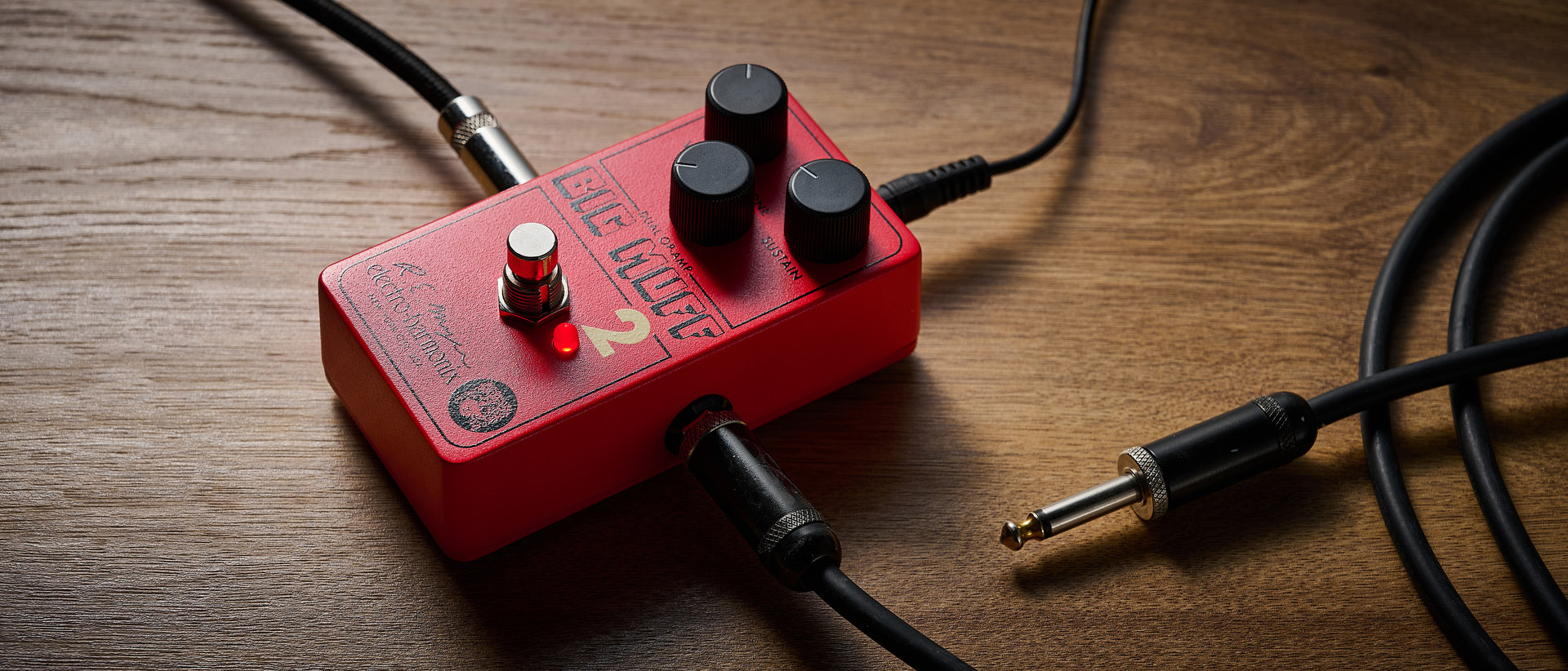 Electro-Harmonix Big Muff Pi 2 Dual Op-Amp Fuzz is built from a lost schematic that's 50 years old but the form factor is familiar for contemporary EHX stompboxes, a three-knob fuzz, red enclosure.
