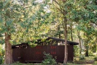 images from cabin crew, a new book on welsh modernist cabins showing small, low timber structures in the woods