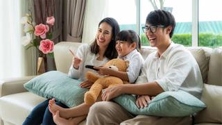 Asian American family watching TV