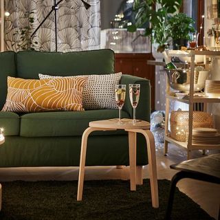 Christmassy living room with sofa and wooden stackable stool