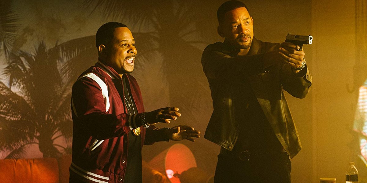 Bad Boys For Life Will Smith aims a gun as Martin Lawrence talks