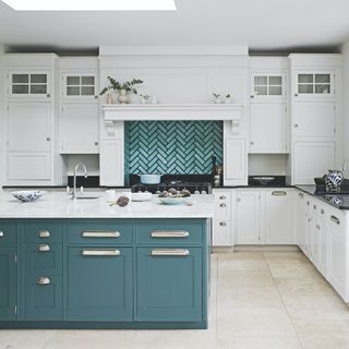 Blue kitchen with white cabinets