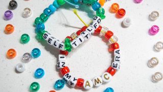 Friendship bracelets that say "Self Titled" and "In My AMC Era."