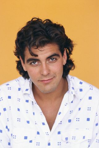 George Clooney poses for a portrait session in Los Angeles, California, May 1985.