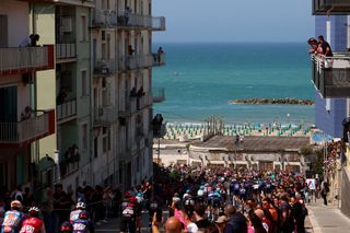 The pack rides in Termoli during the 11th stage of the 107th Giro d'Italia cycling race, 207km between Foiano di Val Fortore and Franca Villa al Mare, on May 15, 2024. (Photo by Luca Bettini / AFP)