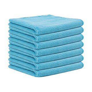 A stack of folded blue microfiber cloths