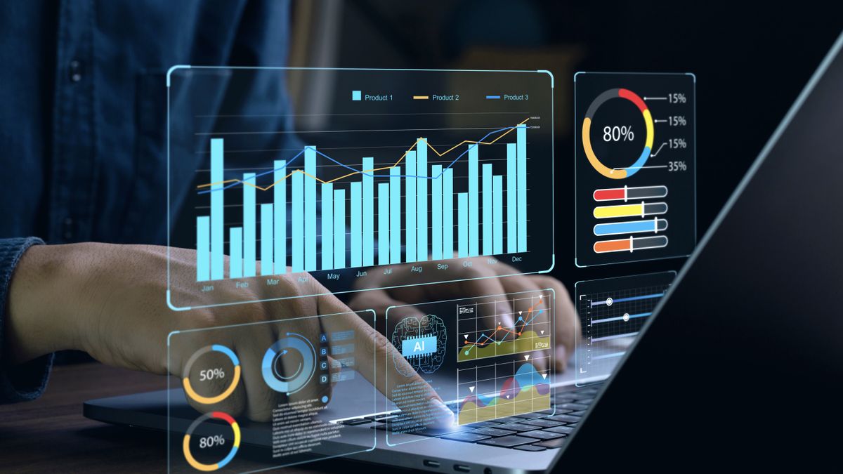 Business analystics graphics overlayed on image of someone using a laptop