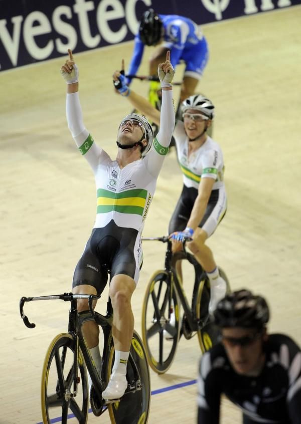 Leigh Howard and Cameron Meyer celebrate their rider in the men's madison race.
