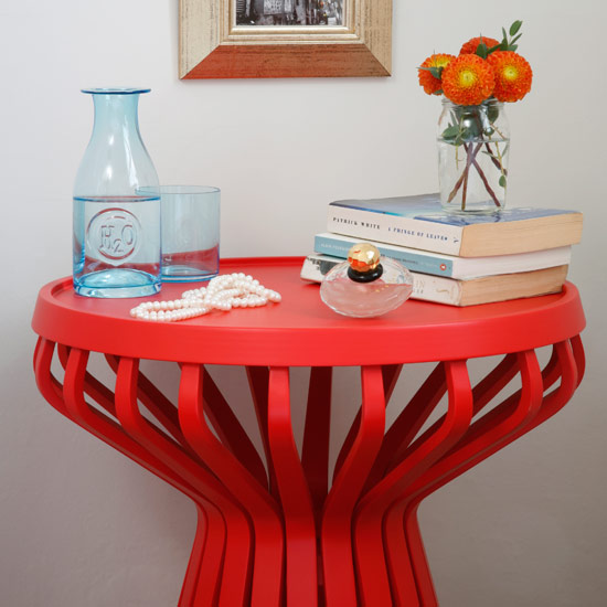 Bedroom with books and flower in vase