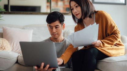 People looking at a laptop