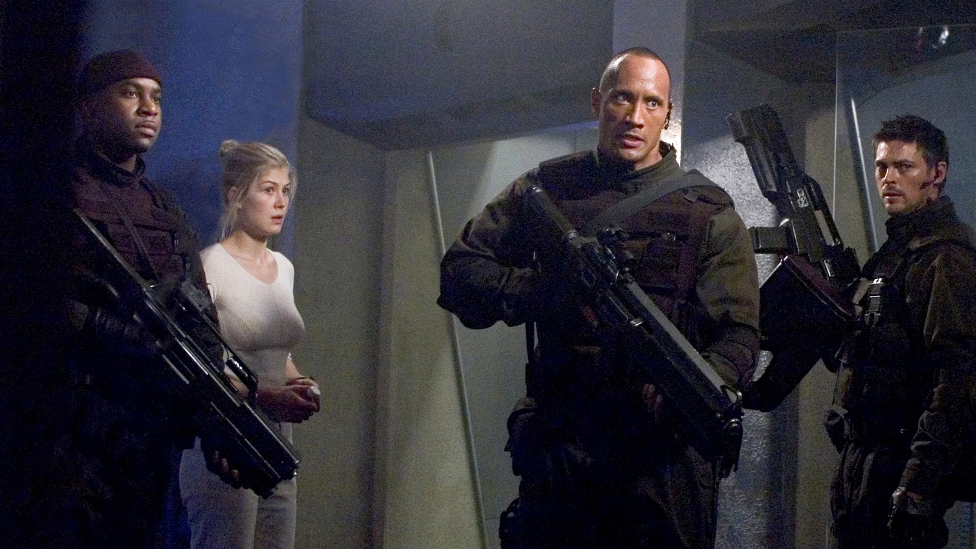 Duke, Sam, Sarge, and Reaper standing in a room in 2005's Doom movie
