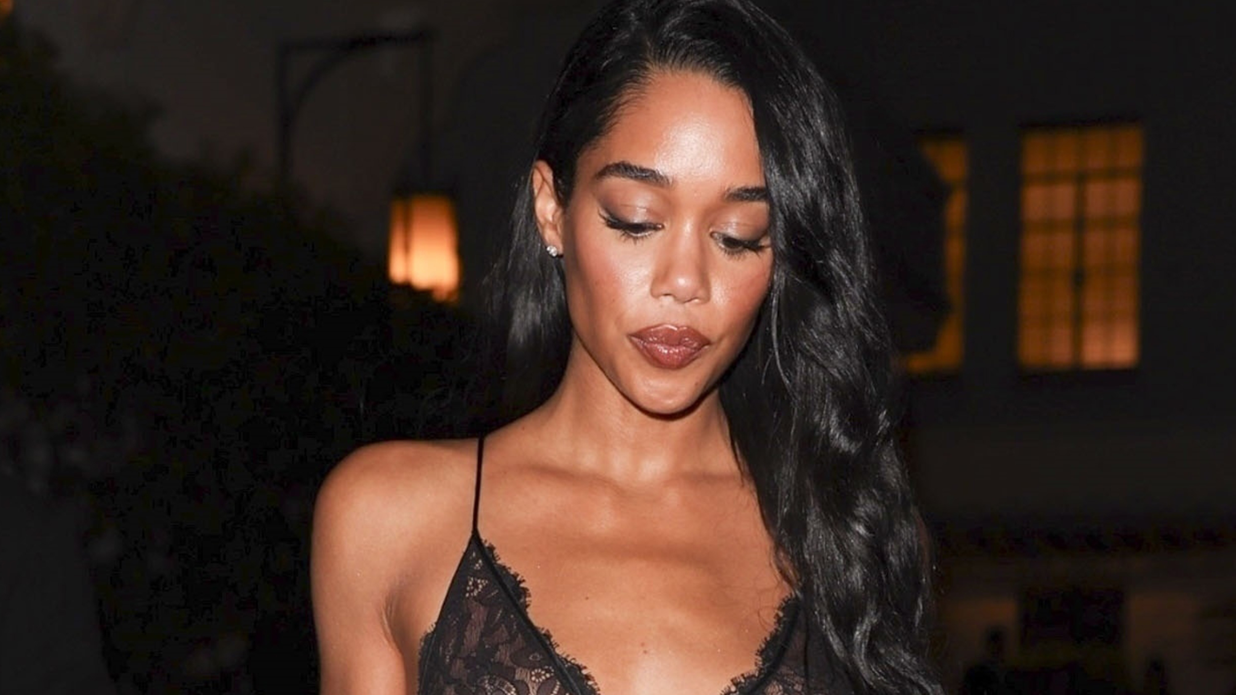 American actress and model Laura Harrier was seen attending the Giorgio Armani after-party at the Chateau Marmont in Los Angeles. She is wearing a black sheer lace dress by Dolce & Gabbana.