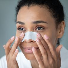 woman applying a pore strip