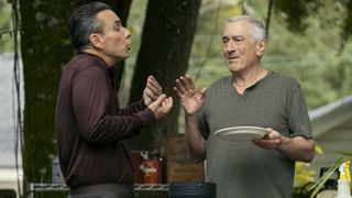 Sebastian Maniscalco and Robert De Niro talking outside in the woods in About My Father