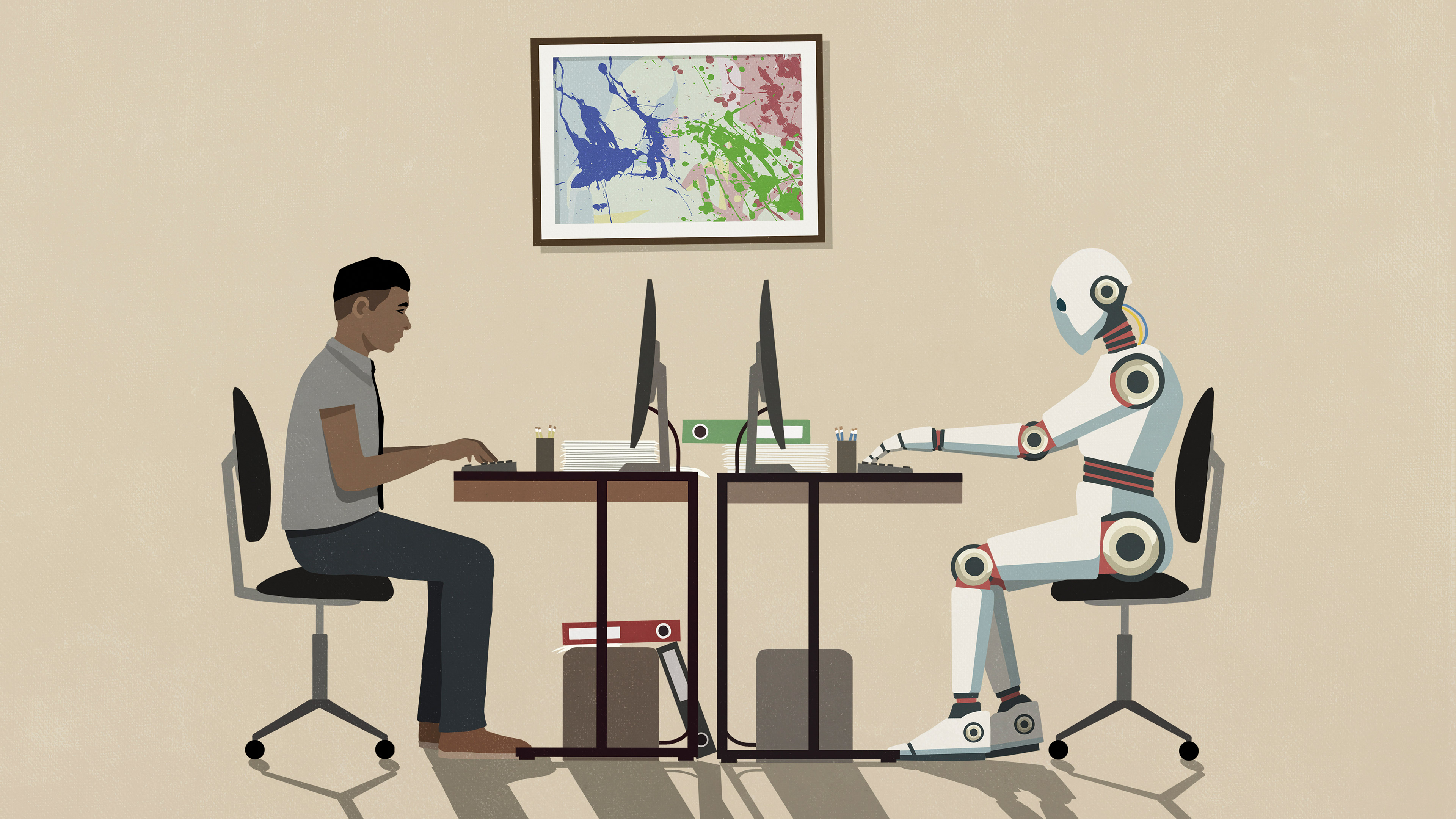 A human and robot sitting opposite each other working at computers in an office environment
