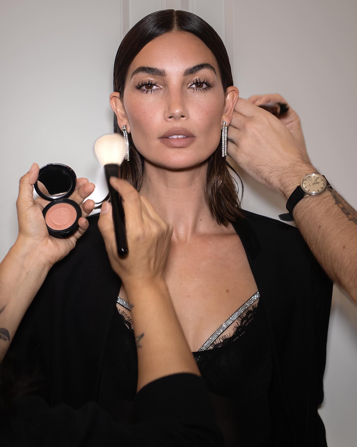Lily Aldridge having makeup applied with best makeup brushes