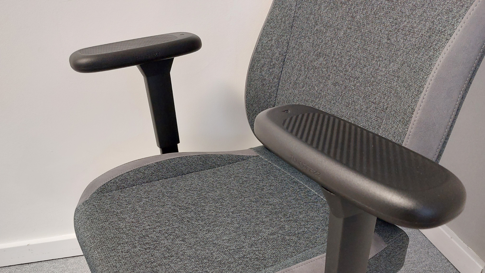 Gaming chairs photographed in an office environment.