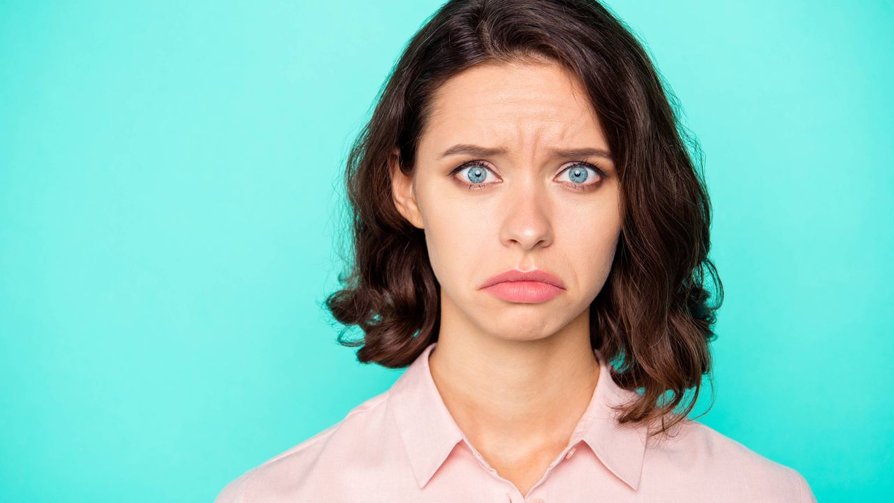 Young woman with a disgusted look on her face