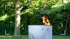  picture of incinerator in garden with fire