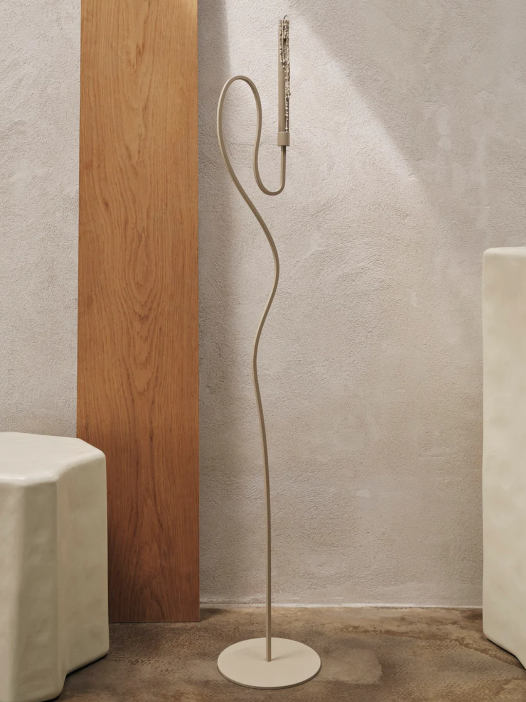 A beige floor candle stand from Ferm Living
