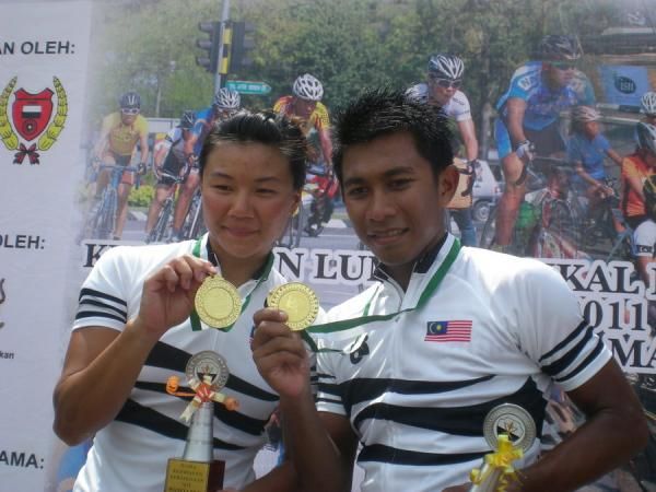 Women's champion Kimberley Yap and men's champion Shahrul Mat Amin