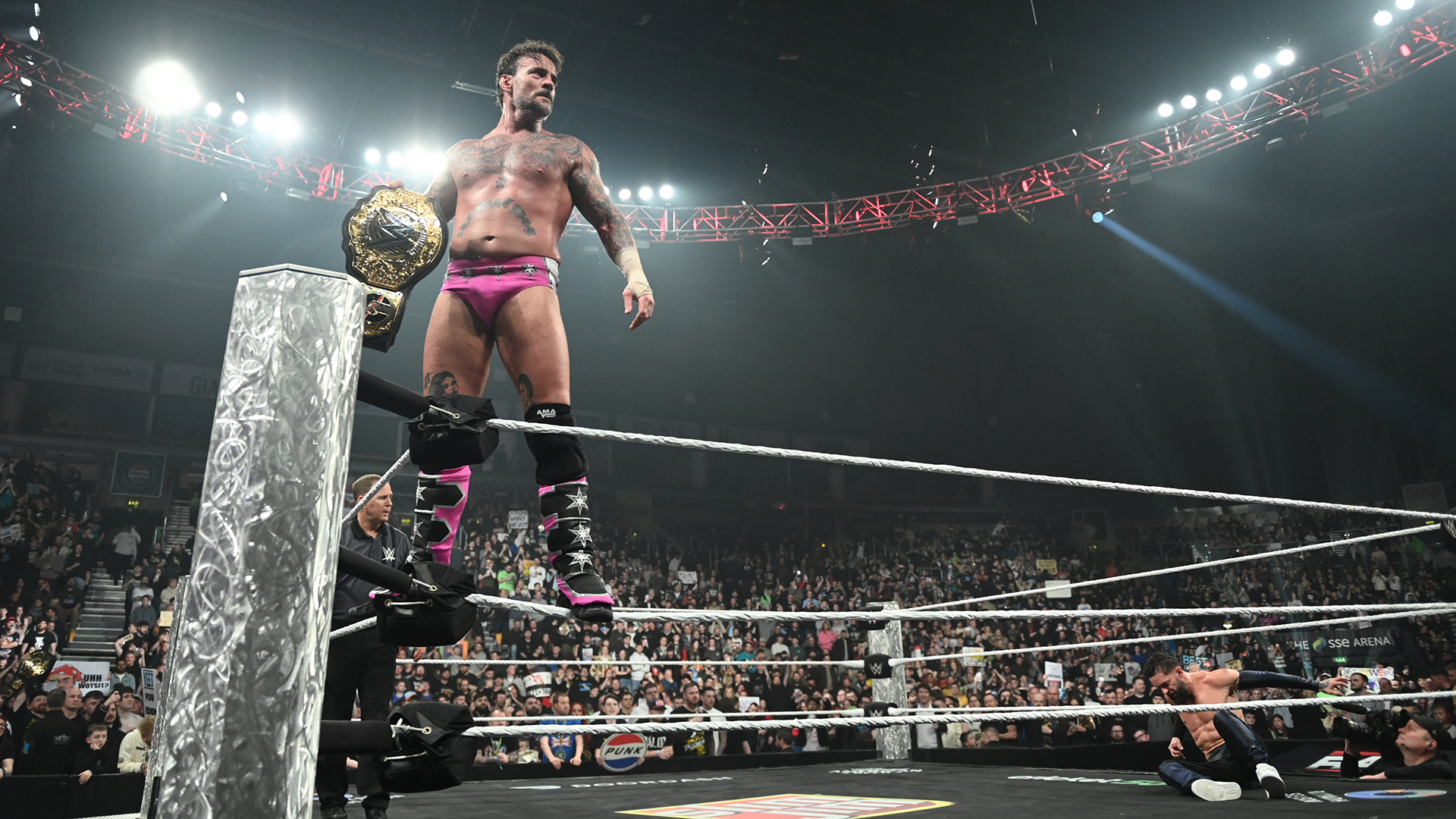 CM Punk holds WWE World Heavyweight Champion's belt in Belfast &ndash; January 2026
