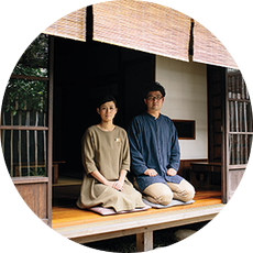 A couple sitting on mat