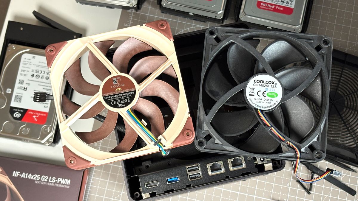 UGreen NASync DXP4800 Pro on a desk with multiple HDDs installed.