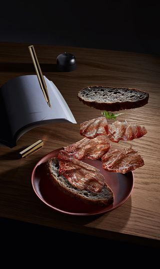 Meat slices on wooden table