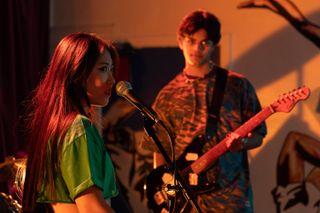 Shing Lin and Dillon rehearsing with their band in Hollyoaks.