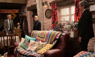 Cain, Belle and Sam looking stressed in their funeral clothes in Emmerdale