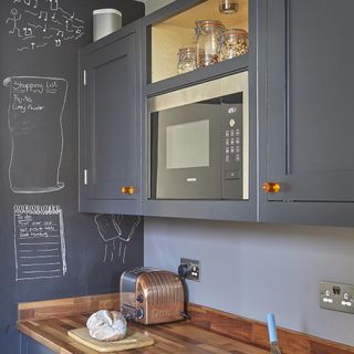 Blue kitchen cabinets with wooden sides