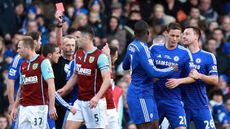 Chelsea's Serbian midfielder Nemanja Matic leaves the pitch after receiving a red card during the English Premier Lea