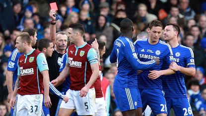 Chelsea's Serbian midfielder Nemanja Matic leaves the pitch after receiving a red card during the English Premier Lea