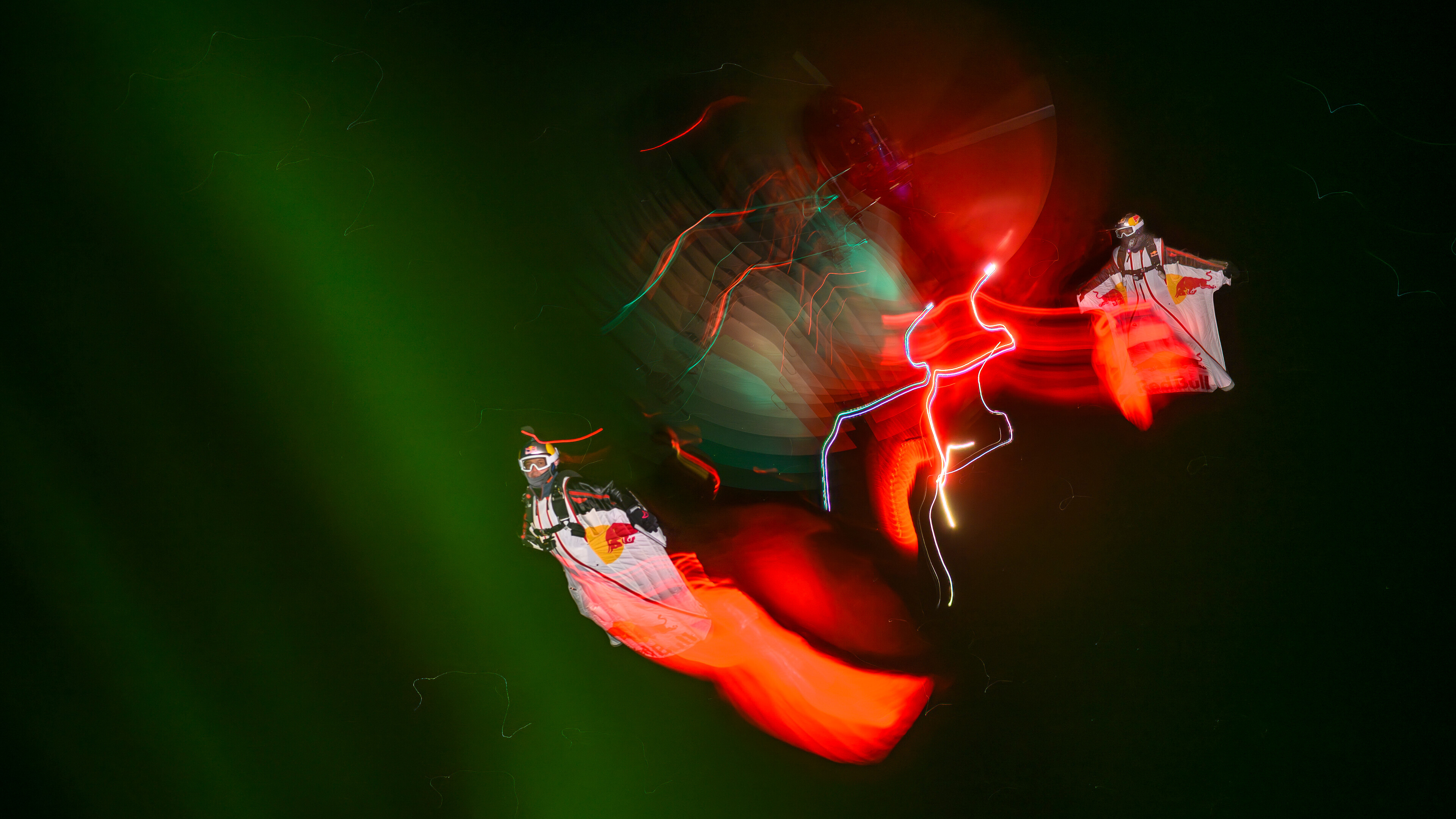Jeff Provenzano and Jon DeVore wingsuit skydiving under the Aurora Borealis near Palmer, Alaska on March 23, 2026.