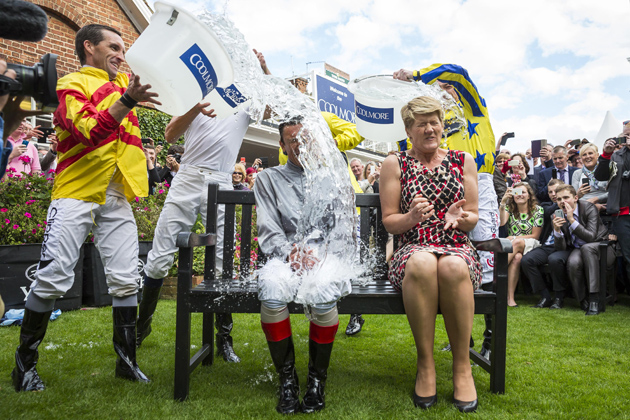 Claire Balding and Frankie Dettori get a soaking while taking part in their ice bucket challenge for charity in 2014