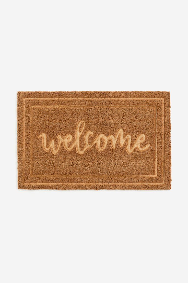 Coconut fiber "welcome" doormat from H&M Home.