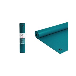 A teal coloured yoga mat rolled up on the left and laid flat on the right side.