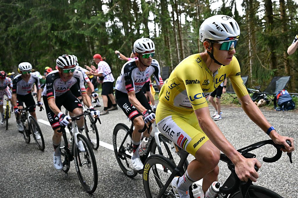 UAE Team Emirates - XRG's Slovenian rider Tadej Pogacar wearing the overall leader's yellow jersey cycles with his teammates in the Grand Ballon ascent during the 14th stage of the 113th edition of the Tour de France cycling race, 155,3 km between Mulhouse and Le Markstein in the Vosges mountains, on July 18, 2026. (Photo by Loic VENANCE / AFP)