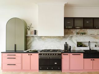 a peach and olive green modern kitchen