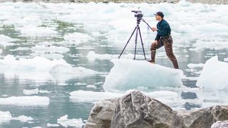 Videographer with tropod on ice in McBride Inlet