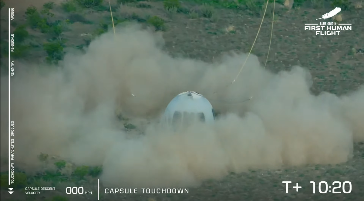 The New Shepard capsule kicks up dust in West Texas on July 20, 2021.