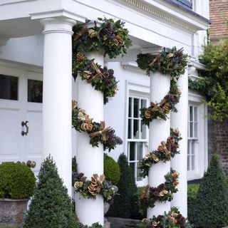 house entrance with white walls and plants
