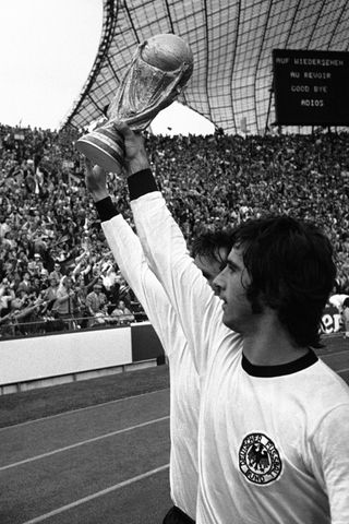 Gerd Muller holds the World Cup aloft after West Germany's victory in 1974