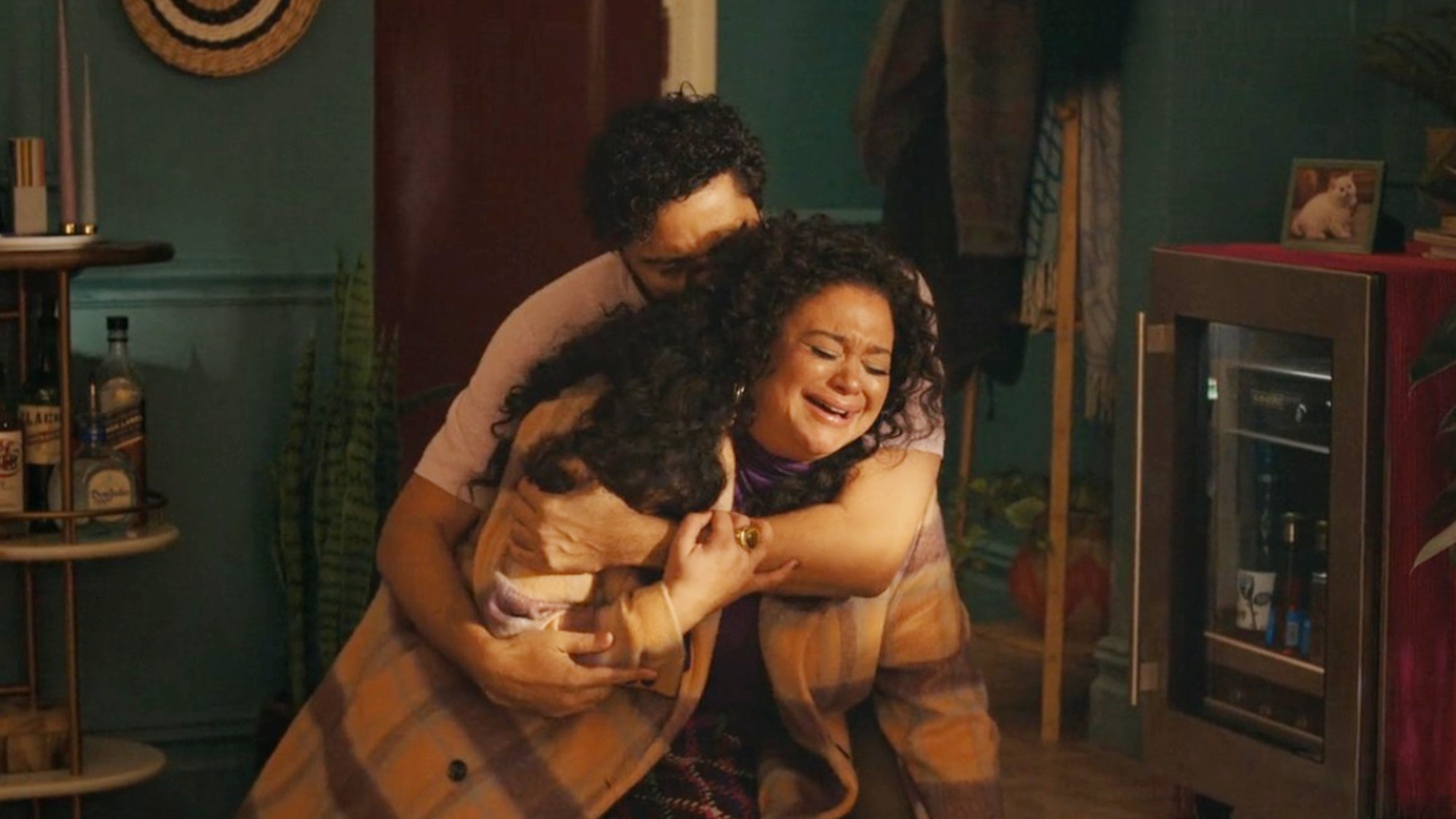 Marouane Zotti holding Michelle Buteau in Survival of the Thickest.