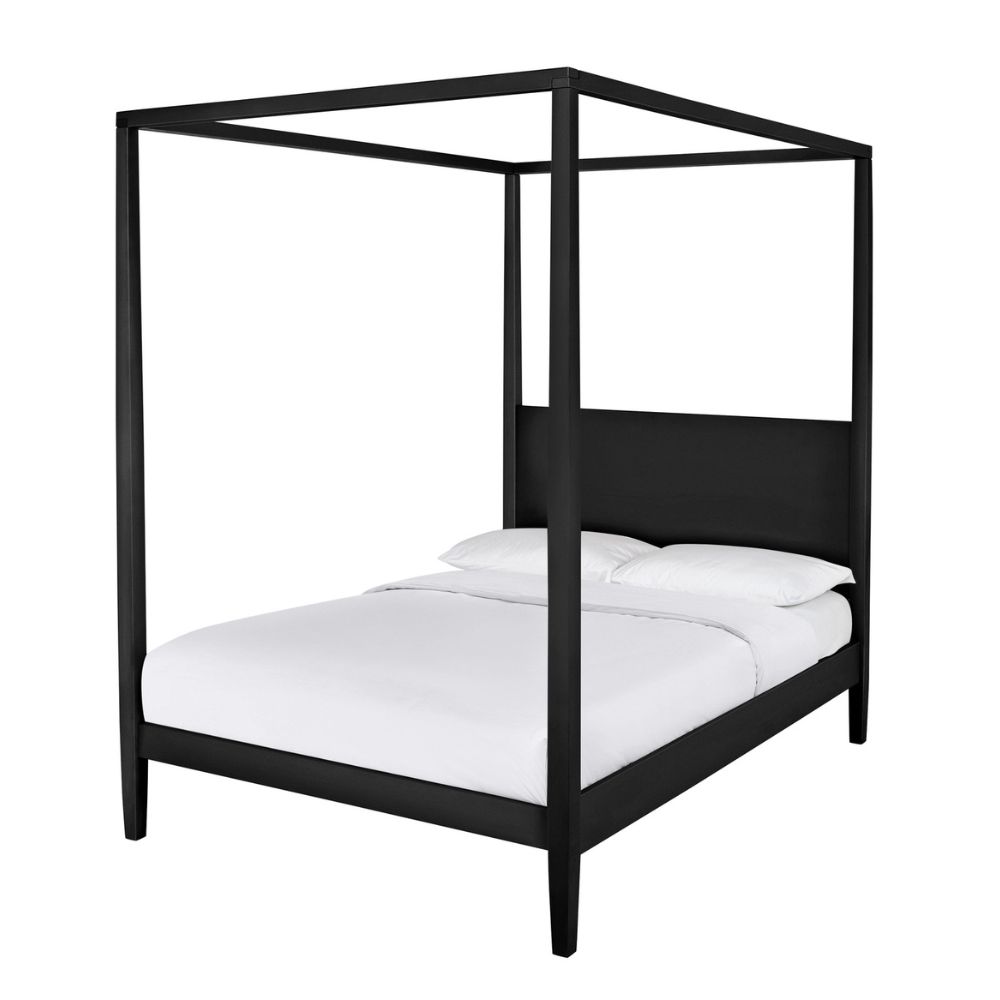 Black four poster bed with white sheets